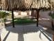 The view from inside the backyard gazebo, featuring a stone bar and well maintained artificial turf at 11118 Scotscraig Ct, Las Vegas, NV 89141