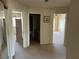 Hallway with access to the main bedroom, bathroom, and bedroom offering carpet and tile flooring at 11118 Scotscraig Ct, Las Vegas, NV 89141