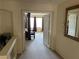 Hallway view of a bedroom featuring neutral carpet and a large window at 11118 Scotscraig Ct, Las Vegas, NV 89141