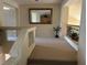 Upstairs hallway with neutral carpet and view of the home's interior at 11118 Scotscraig Ct, Las Vegas, NV 89141