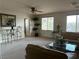 Upstairs living room with carpet, ceiling fan, and furniture, featuring seating area with natural light at 11118 Scotscraig Ct, Las Vegas, NV 89141