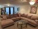 Spacious living area features a large sectional sofa and glass coffee table at 11118 Scotscraig Ct, Las Vegas, NV 89141