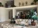 Spacious living room with neutral colors and views into the open dining area at 11118 Scotscraig Ct, Las Vegas, NV 89141
