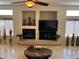 Stylish living room showcasing a fireplace with decorative niches, tile flooring and recessed lighting at 11118 Scotscraig Ct, Las Vegas, NV 89141