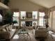 Living room with decorative fireplace, two couches, and an elegant glass coffee table at 11118 Scotscraig Ct, Las Vegas, NV 89141
