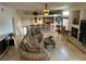 Spacious living room with large windows and a cozy fireplace at 11118 Scotscraig Ct, Las Vegas, NV 89141