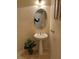 Cozy powder room featuring a pedestal sink, decorative mirror, and neutral wall color at 11118 Scotscraig Ct, Las Vegas, NV 89141