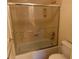 Bright bathroom featuring a glass enclosed bathtub and shower at 11118 Scotscraig Ct, Las Vegas, NV 89141