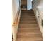 Carpeted staircase with wooden handrail and white trim leads to the upper level at 11118 Scotscraig Ct, Las Vegas, NV 89141