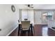 Bright dining room with modern table, wood flooring, and natural light from the window at 1888 Apricot Ct, Henderson, NV 89014