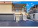 Exterior shot of condo with garages and a covered balcony at 1888 Apricot Ct, Henderson, NV 89014