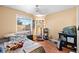 Comfortable bedroom with a ceiling fan and a large window providing natural light at 1940 Solana Del Norte Way, North Las Vegas, NV 89031