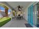 Covered back patio with ceiling fans and a dining table at 2010 Spruce Brook Dr, Henderson, NV 89074