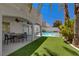 Spacious backyard offers a private pool and covered patio, perfect for relaxing and entertaining outdoors at 2010 Spruce Brook Dr, Henderson, NV 89074
