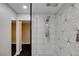 A modern bathroom is highlighted by a frameless glass shower with multiple shower heads at 2010 Spruce Brook Dr, Henderson, NV 89074