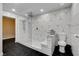 This bright bathroom features geometric tile patterns, a glass enclosed shower and toilet at 2010 Spruce Brook Dr, Henderson, NV 89074