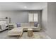 Well-lit bedroom featuring a cozy sofa and neutral decor at 2010 Spruce Brook Dr, Henderson, NV 89074