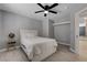Bedroom featuring a queen bed, open closet space, and stylish light wood floors at 2010 Spruce Brook Dr, Henderson, NV 89074