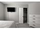 Bedroom features a modern flatscreen TV, ceiling fan and a built-in closet at 2010 Spruce Brook Dr, Henderson, NV 89074
