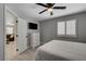 Bedroom with a queen bed, large window with shutters, and a dresser with a TV at 2010 Spruce Brook Dr, Henderson, NV 89074