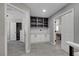 Hallway with custom built-in cabinetry, storage, and entryways to bedrooms at 2010 Spruce Brook Dr, Henderson, NV 89074