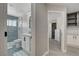 Hallway showcases a bathroom with a shower and a bedroom featuring a large window at 2010 Spruce Brook Dr, Henderson, NV 89074