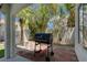 Outdoor patio area featuring a built-in grill for outdoor cooking and checkered stone tile at 2010 Spruce Brook Dr, Henderson, NV 89074