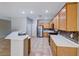 Well-lit kitchen features stainless steel appliances, tile flooring, and ample cabinet space at 2215 Bensley St, Henderson, NV 89044