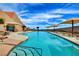 Resort-style pool with mountain views, lounge chairs, and plenty of space to relax at 2215 Bensley St, Henderson, NV 89044