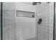Updated shower with hexagon tile accent and white subway tile surround at 2241 Verde Cape Ave, Henderson, NV 89052