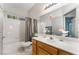Bathroom featuring large mirror, vanity with storage, and shower/tub combo at 2241 Verde Cape Ave, Henderson, NV 89052