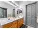 Bright bathroom featuring a double sink vanity, ample lighting, and modern fixtures at 2241 Verde Cape Ave, Henderson, NV 89052