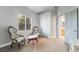 Cozy bedroom with plush armchairs, a window view, and a closet at 2241 Verde Cape Ave, Henderson, NV 89052