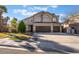 Inviting two-story home with a three-car garage and manicured front lawn at 2241 Verde Cape Ave, Henderson, NV 89052