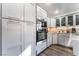 Modern kitchen featuring updated cabinetry, stainless steel appliances, and quartz counters at 2241 Verde Cape Ave, Henderson, NV 89052