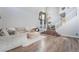 Spacious living room featuring hardwood floors, staircase, and modern decor at 2241 Verde Cape Ave, Henderson, NV 89052