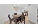 Dining area with wood table and 4 chairs with adjacent access to the kitchen at 2300 E Silverado Ranch Blvd # 2040, Las Vegas, NV 89183
