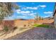 Low maintenance backyard with a stone-paved patio and artificial grass at 2910 Ventana Ridge Ave, Henderson, NV 89044