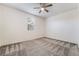 This bedroom features neutral carpeting and a ceiling fan, providing a cozy and comfortable ambiance at 2910 Ventana Ridge Ave, Henderson, NV 89044