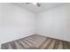 Minimalist bedroom with neutral carpet, white walls, and a ceiling fan at 2910 Ventana Ridge Ave, Henderson, NV 89044