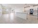 Open-concept living space features a modern kitchen with an island and stainless steel appliances at 2910 Ventana Ridge Ave, Henderson, NV 89044