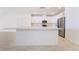 Modern kitchen island features a sleek countertop, with stainless steel appliances at 2910 Ventana Ridge Ave, Henderson, NV 89044