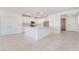 Bright, open kitchen with white cabinetry, stainless steel appliances, and a large center island at 2910 Ventana Ridge Ave, Henderson, NV 89044