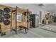 Garage area with gym equipment and built in storage at 2925 Hidden Hollow Cir, Logandale, NV 89021