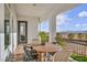 Inviting outdoor dining on the patio with mountain views and wrought iron railing at 2925 Hidden Hollow Cir, Logandale, NV 89021