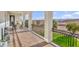 Wide patio with an outdoor dining set and wrought iron railing overlooking landscaped scenery at 2925 Hidden Hollow Cir, Logandale, NV 89021