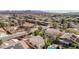 Overhead view of a desert community with neighborhood homes each featuring pools and mature landscaping at 344 E Rush Ave, Las Vegas, NV 89183