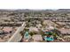 Aerial view of a residential neighborhood featuring single-Gathering homes, desert landscaping, and a community pool at 344 E Rush Ave, Las Vegas, NV 89183