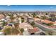 Aerial view of a single Gathering home with mature landscaping and a two-car garage in a desert community at 344 E Rush Ave, Las Vegas, NV 89183