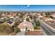 Aerial view of a single-Gathering home featuring a well-manicured front yard, a pool, and a two-car garage at 344 E Rush Ave, Las Vegas, NV 89183